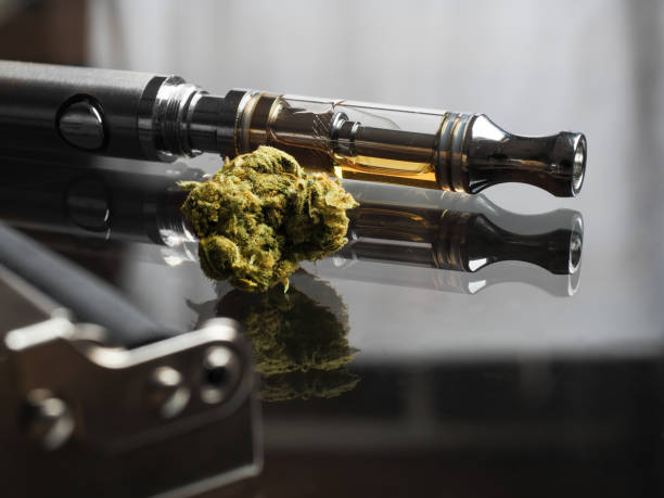 Two Vape Cartridges Side-By-Side, Containing "Raw THCA" and "Blend," With Cannabis Buds In The Background.